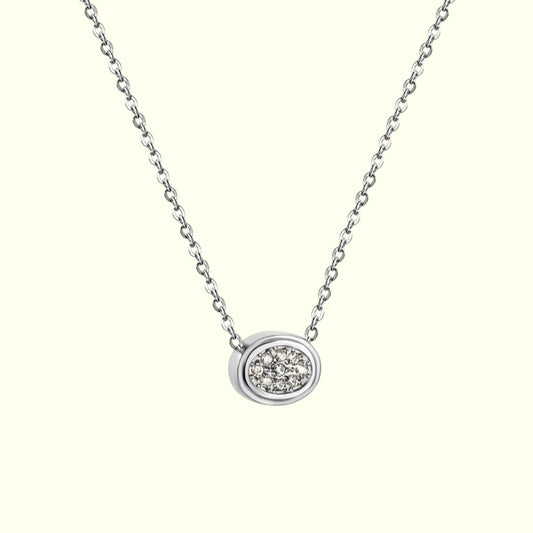 Silver necklace with a round diamond pendant on a white background