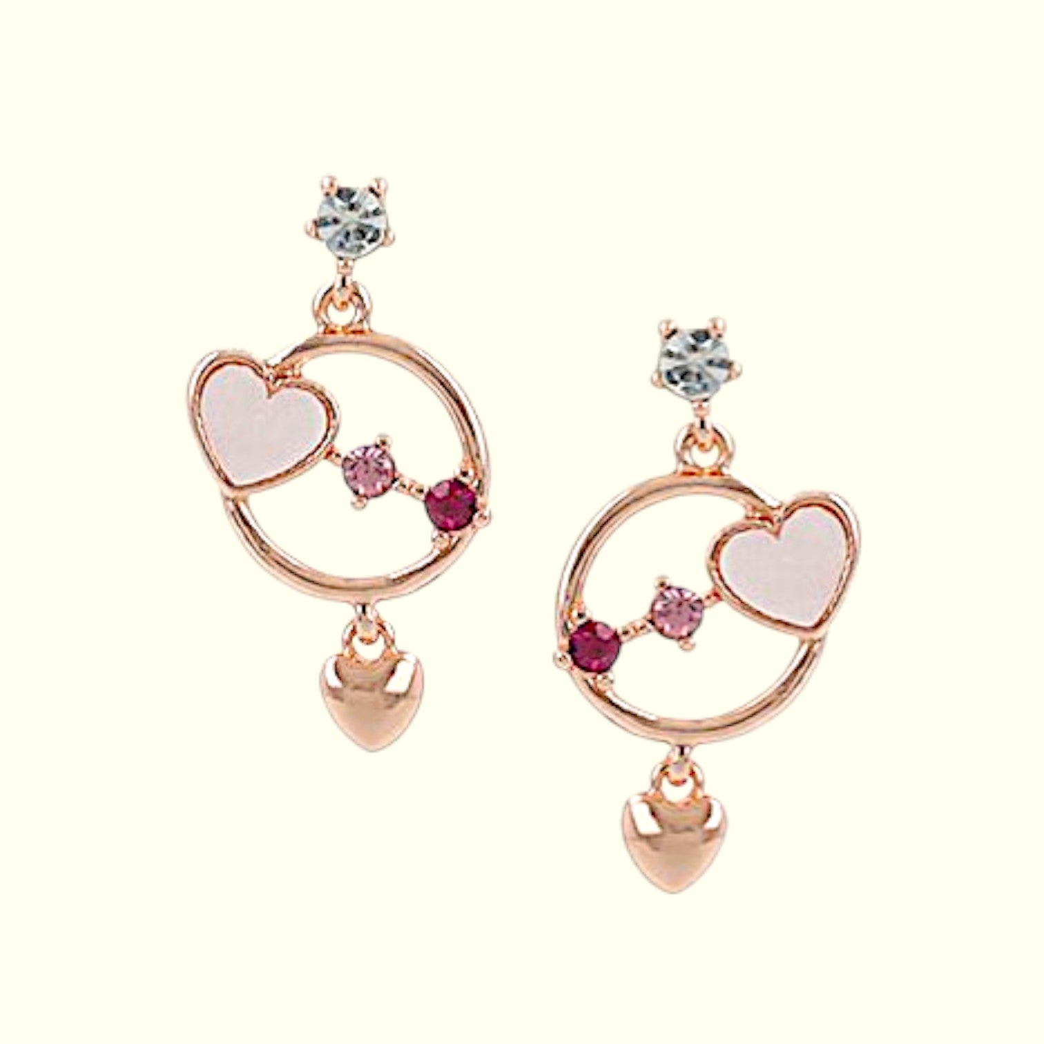 Pair of earrings with heart designs on a white background