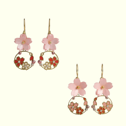 Pair of floral earrings with pink and red flowers on a white background