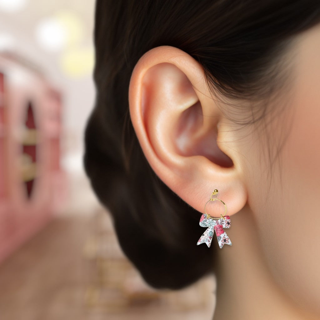 Close-up of an ear wearing a decorative earring with a blurred background