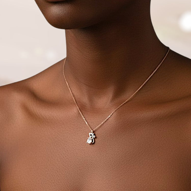 Necklace with a pendant worn by a person against a neutral background