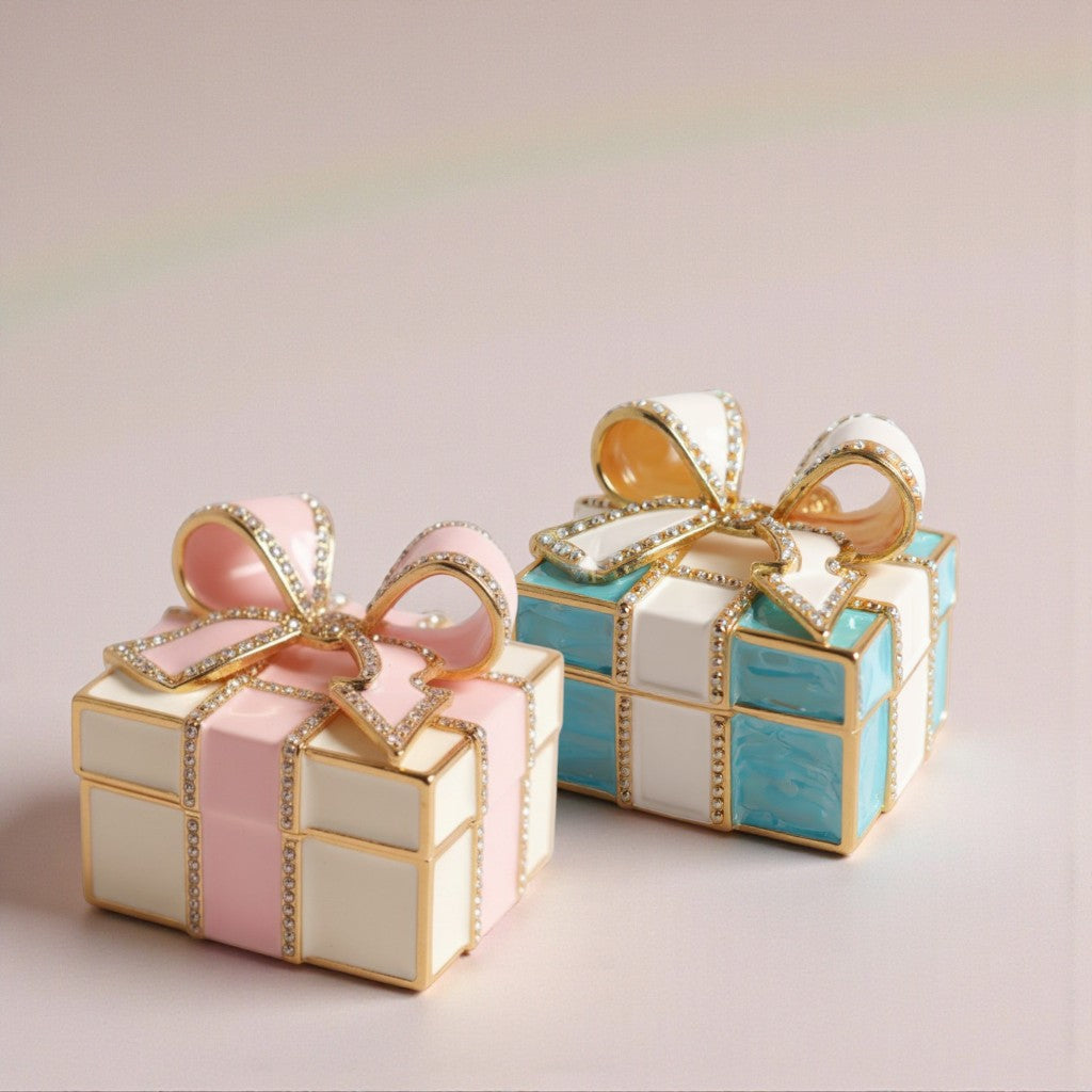 Two decorative gift boxes with ribbons on a light background