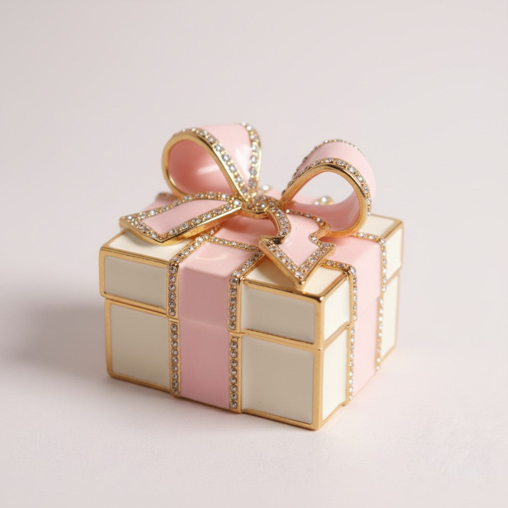 Decorative box with a pink ribbon and gold accents on a light background