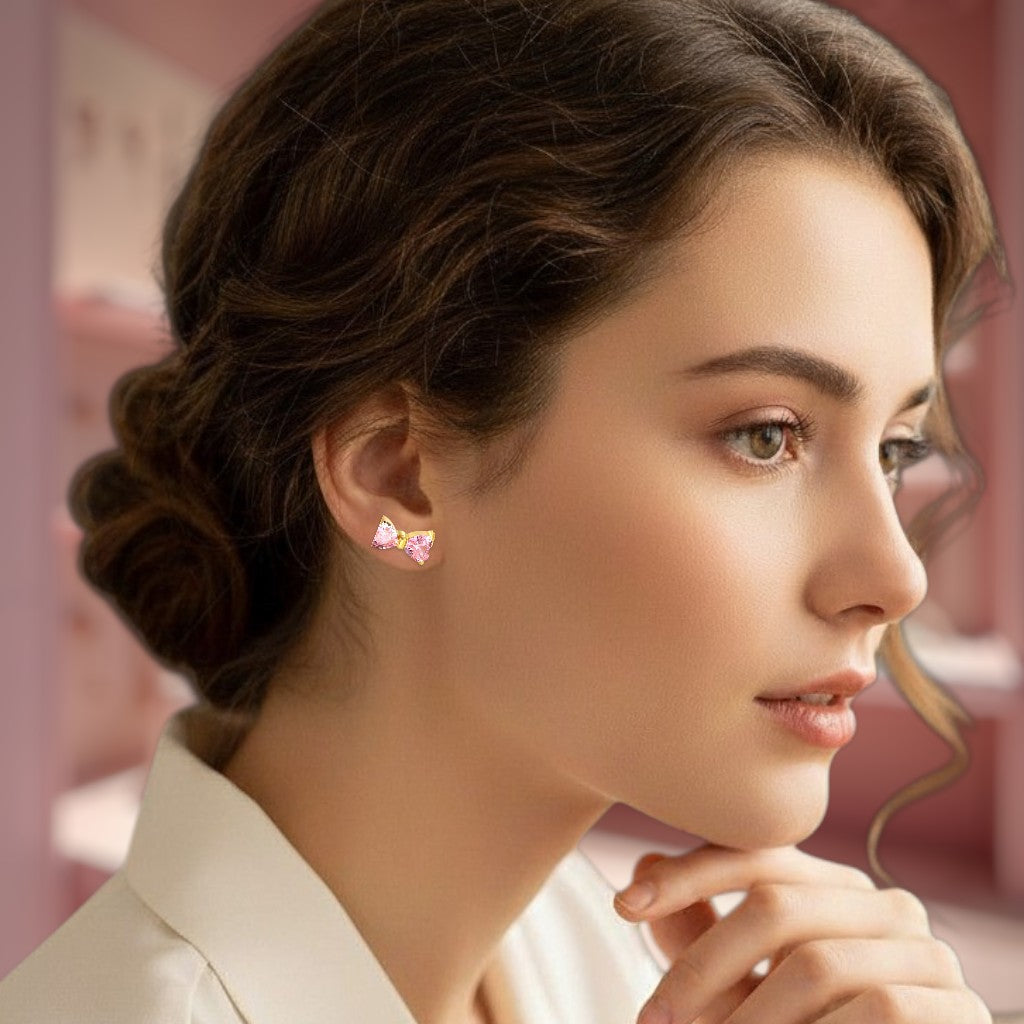 Woman wearing pink earrings with a blurred background