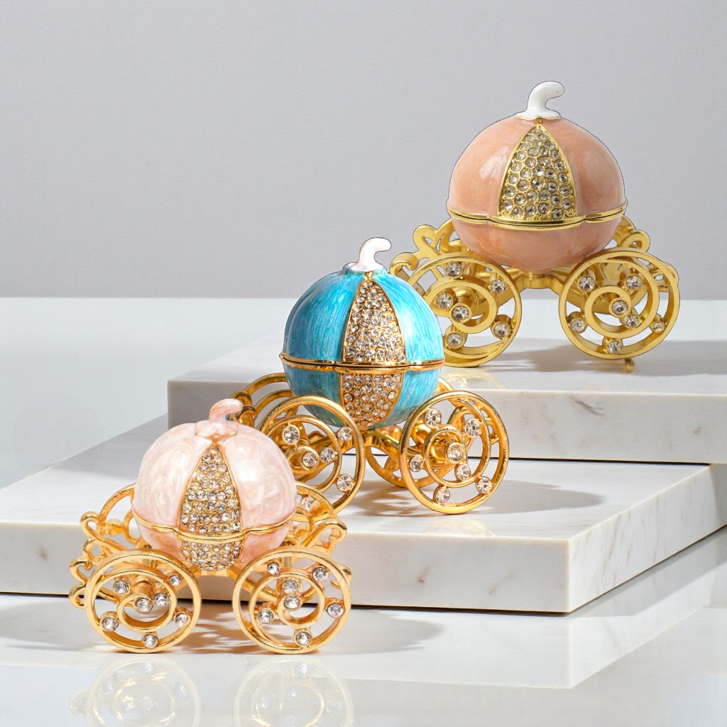 Decorative carriages with pink, blue, and peach bodies on a white surface.