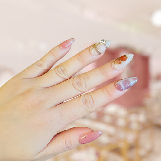Close-up of a hand with stylish nail art on a blurred background