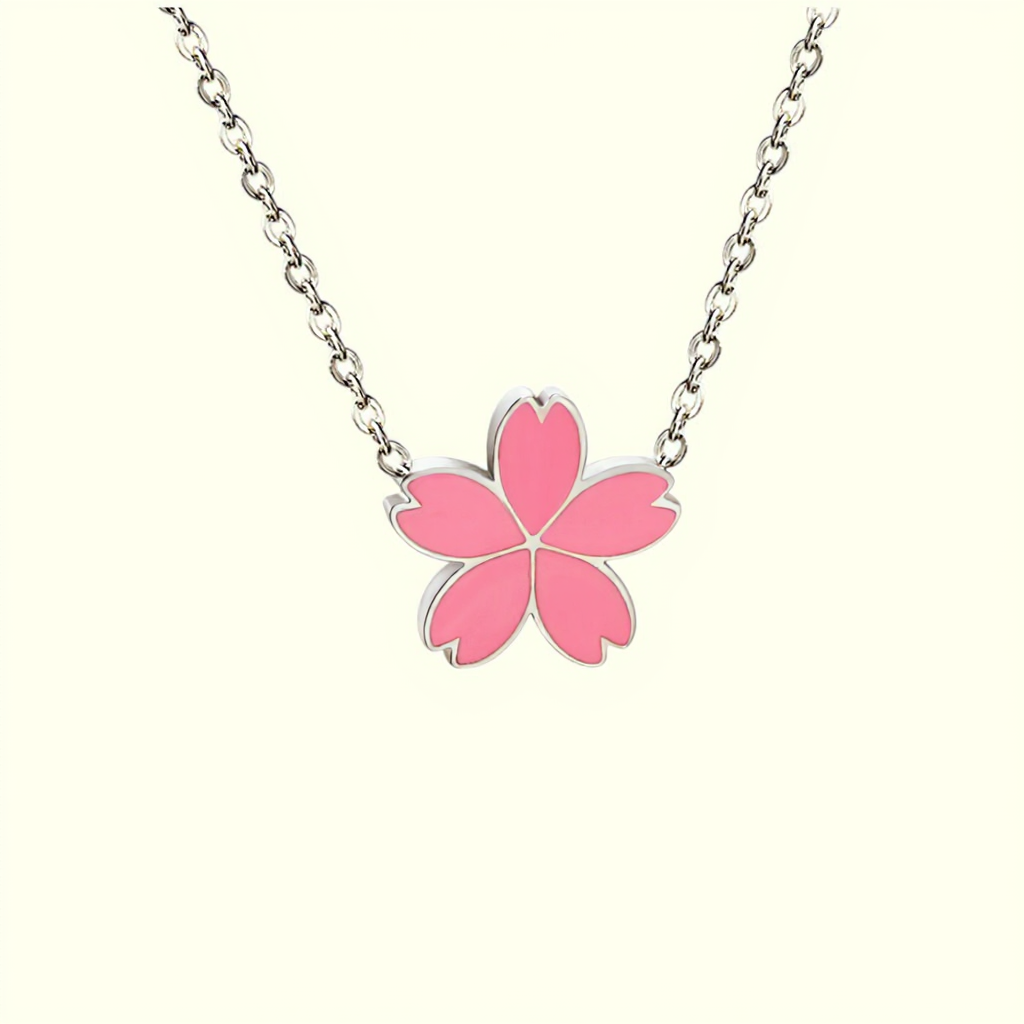 Silver chain Necklace with a pink flower pendant on a white background