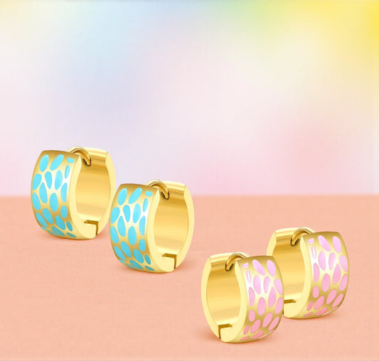 Gold hoop earrings with blue and pink enamel patterns on a gradient background