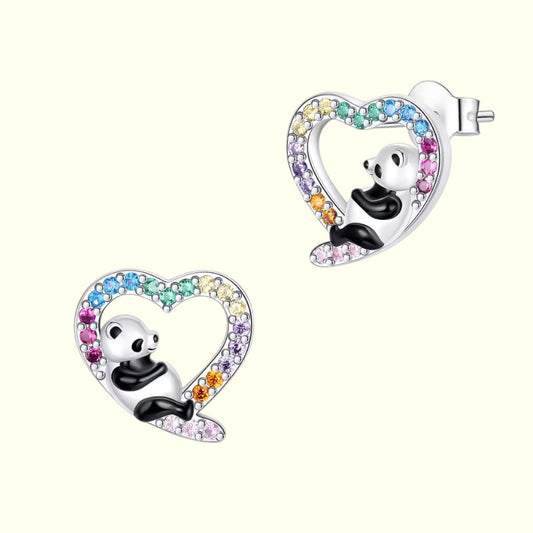 Panda-shaped earrings with heart designs and colorful gemstones on a white background