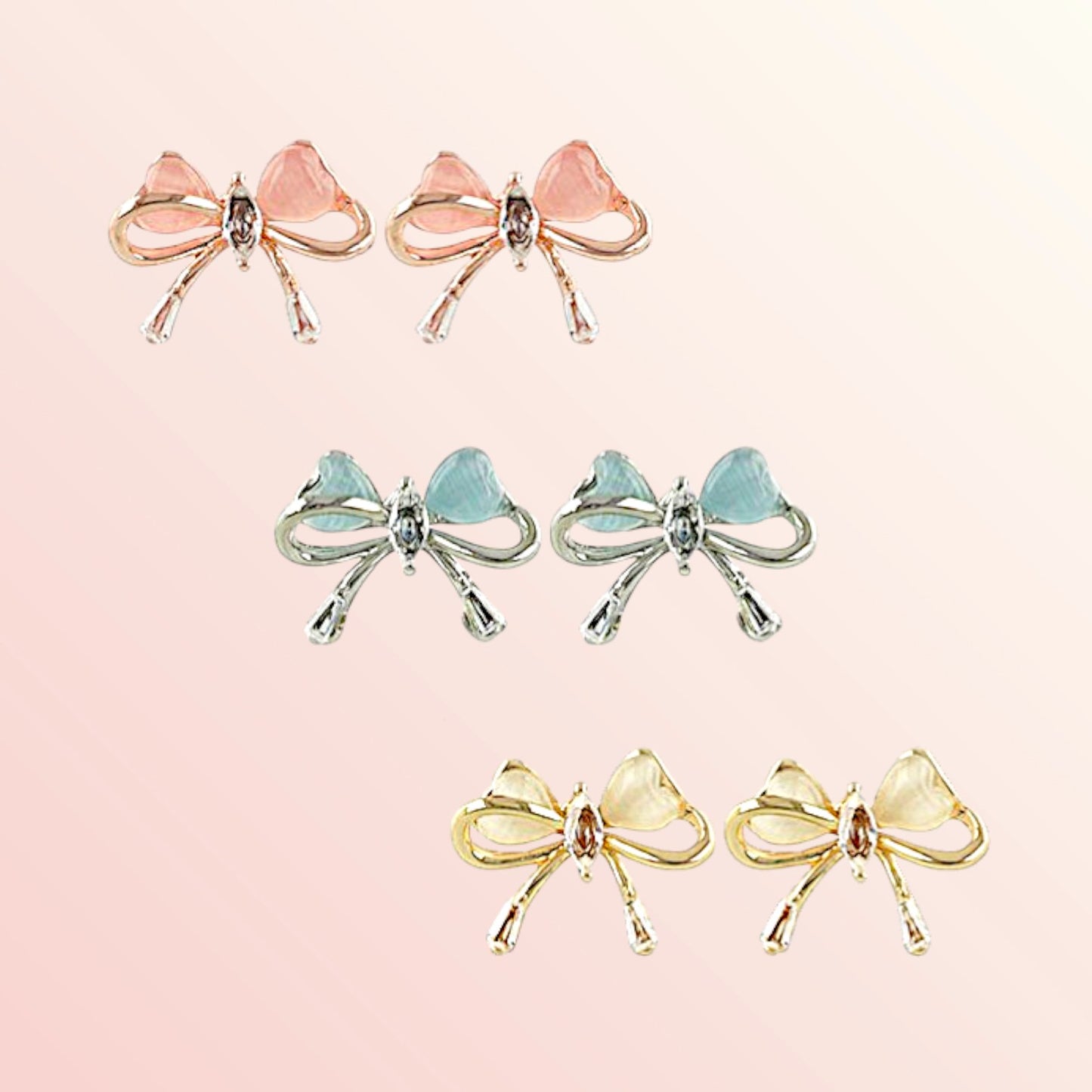 Set of bow-shaped earrings in pink, blue, and yellow on a light pink background