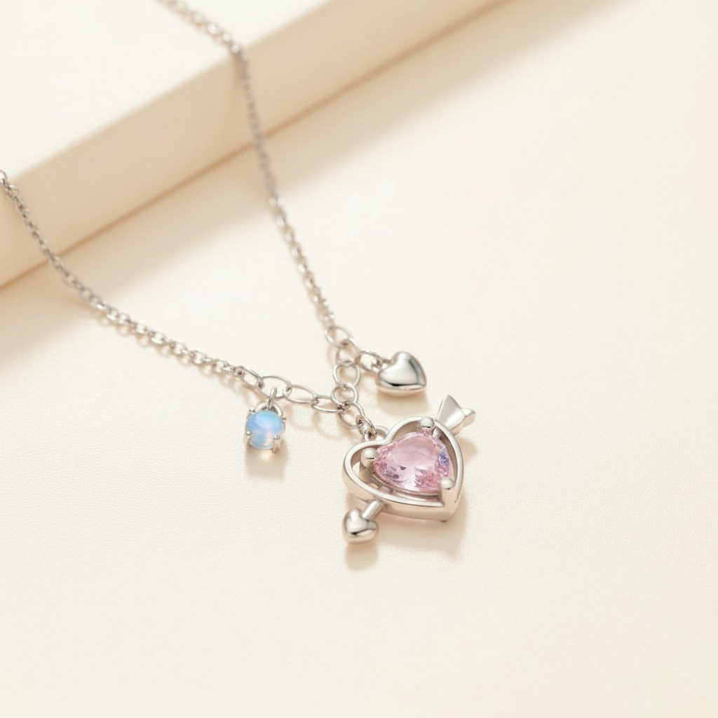 Necklace with heart-shaped pendants on a light beige background