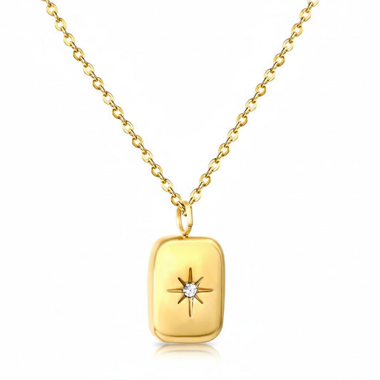 Gold stainless steel rectangular pendant necklace with sparkling North Star detail.