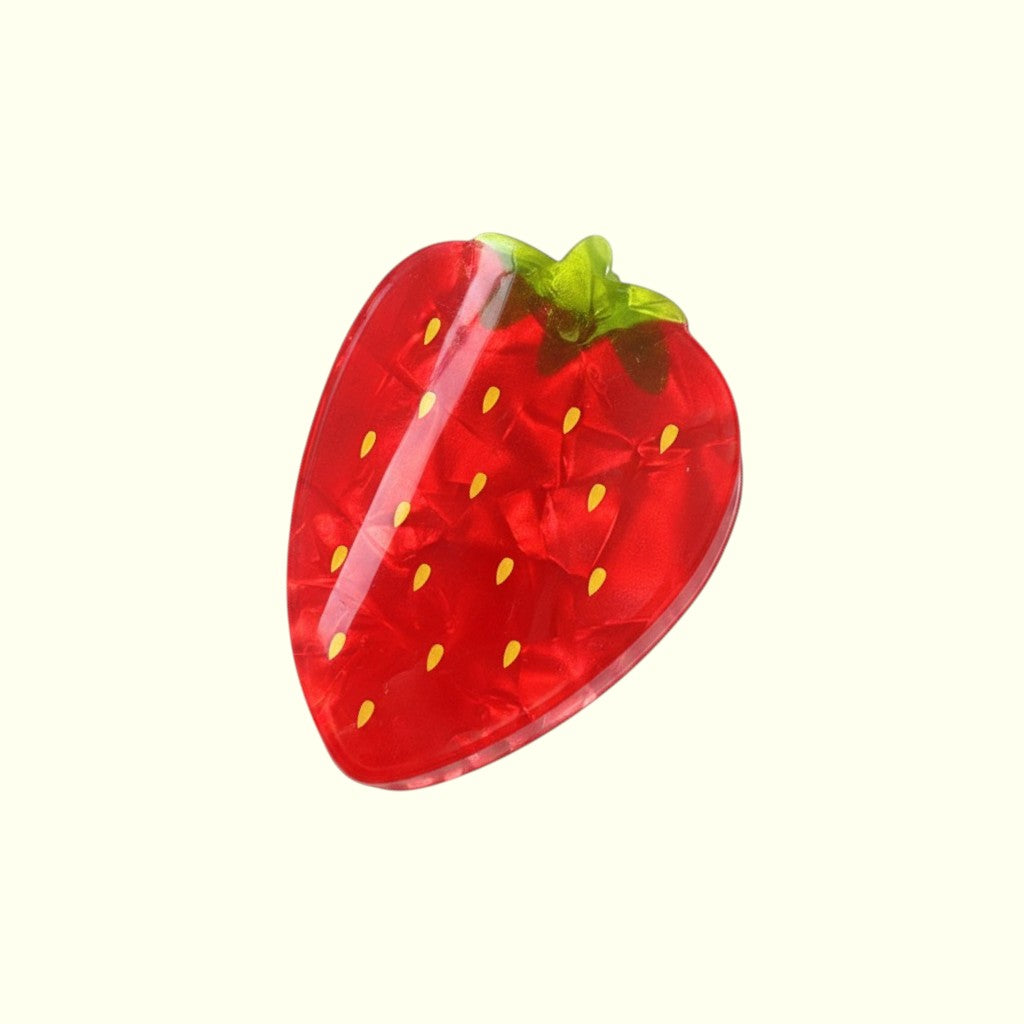 Strawberry-shaped object with red body and green top on a white background