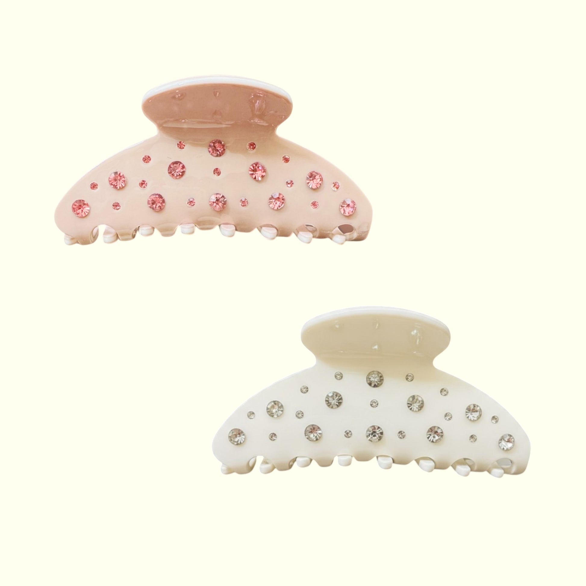 Two decorative hair clips with floral and gemstone details on a white background