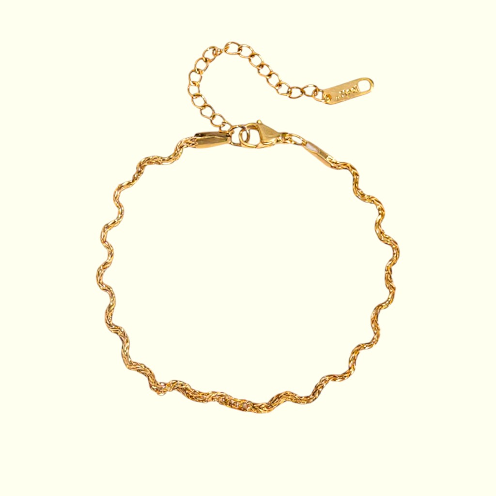 Gold bracelet on a white background