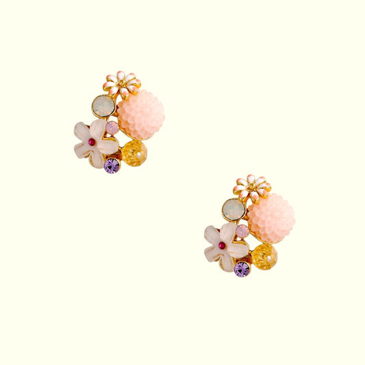 Colorful floral earrings on a white background
