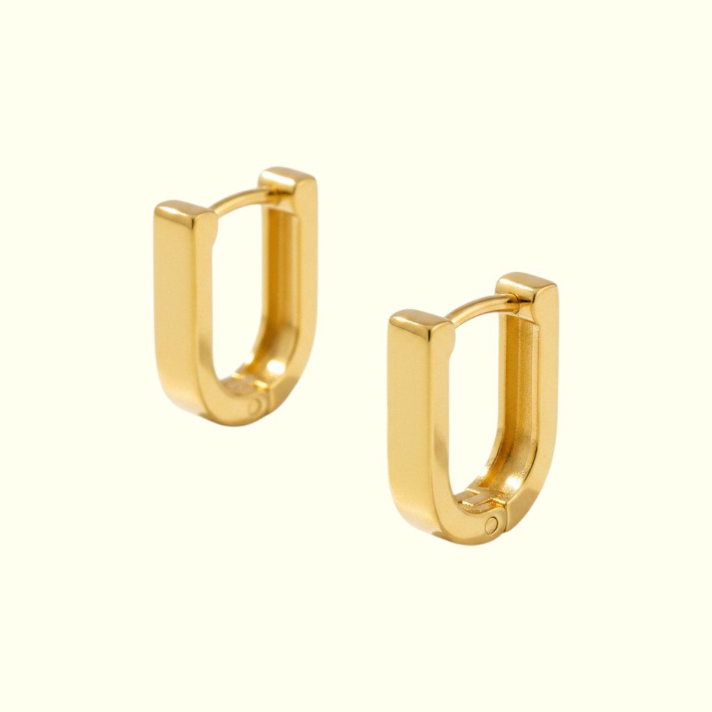 Gold hoop earrings on a white background