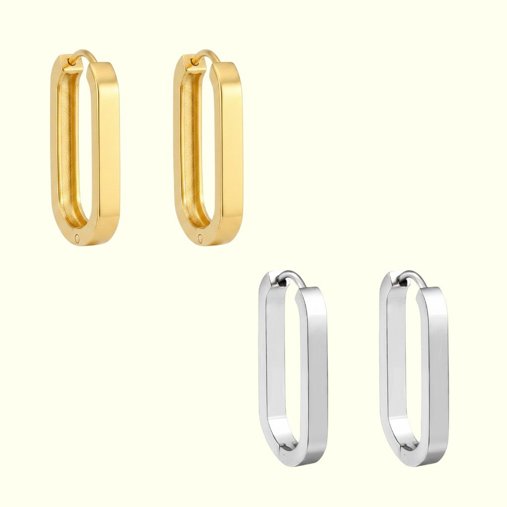 Two pairs of hoop earrings, one gold and one silver, on a white background.