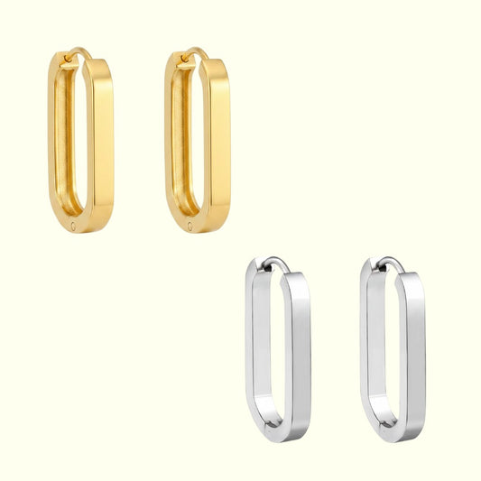 Two pairs of hoop earrings, one gold and one silver, on a white background.