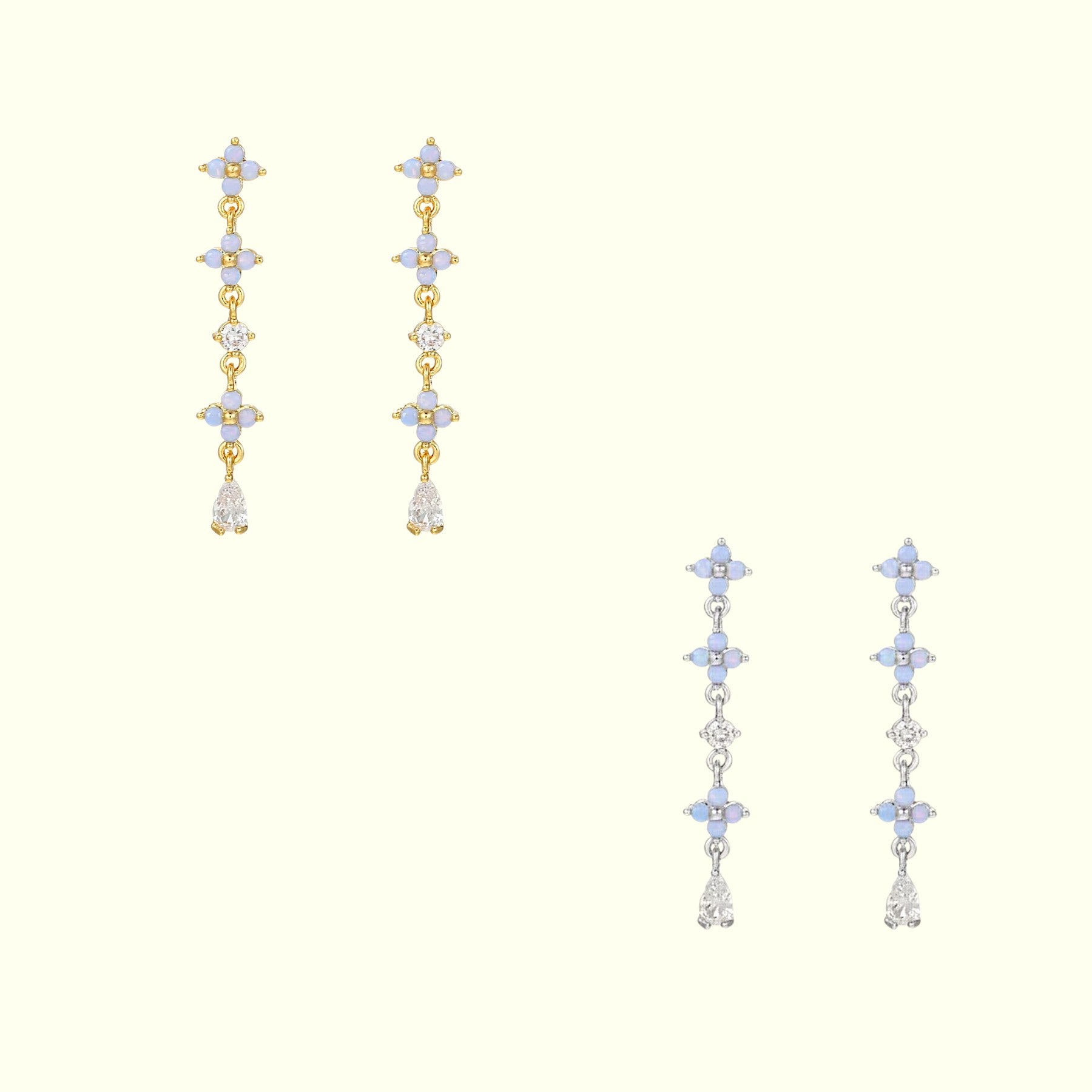 Pair of gold and silver earrings with star-shaped elements on a white background