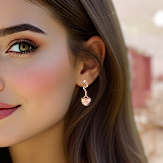 Close-up of a woman wearing a heart-shaped earring with a blurred background