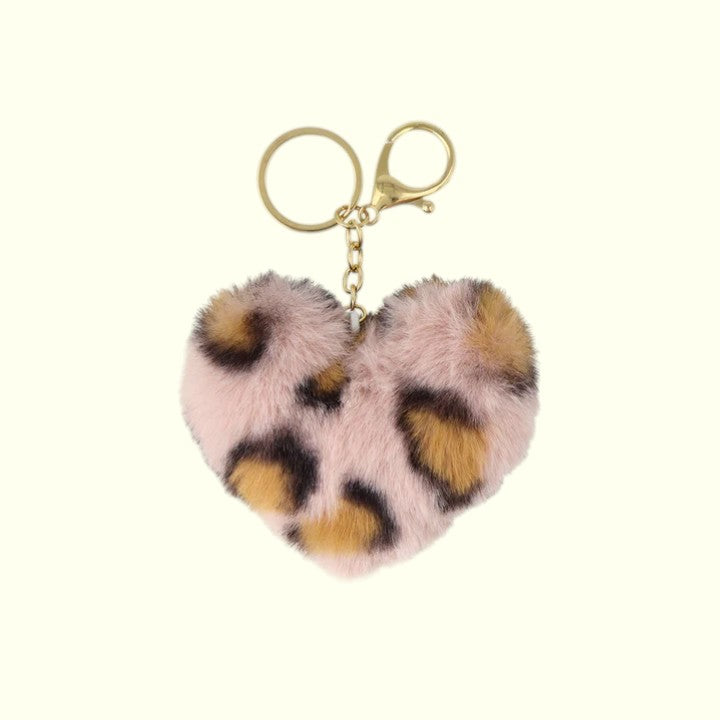 Heart-shaped keychain with leopard print and pink fluffy texture on a white background